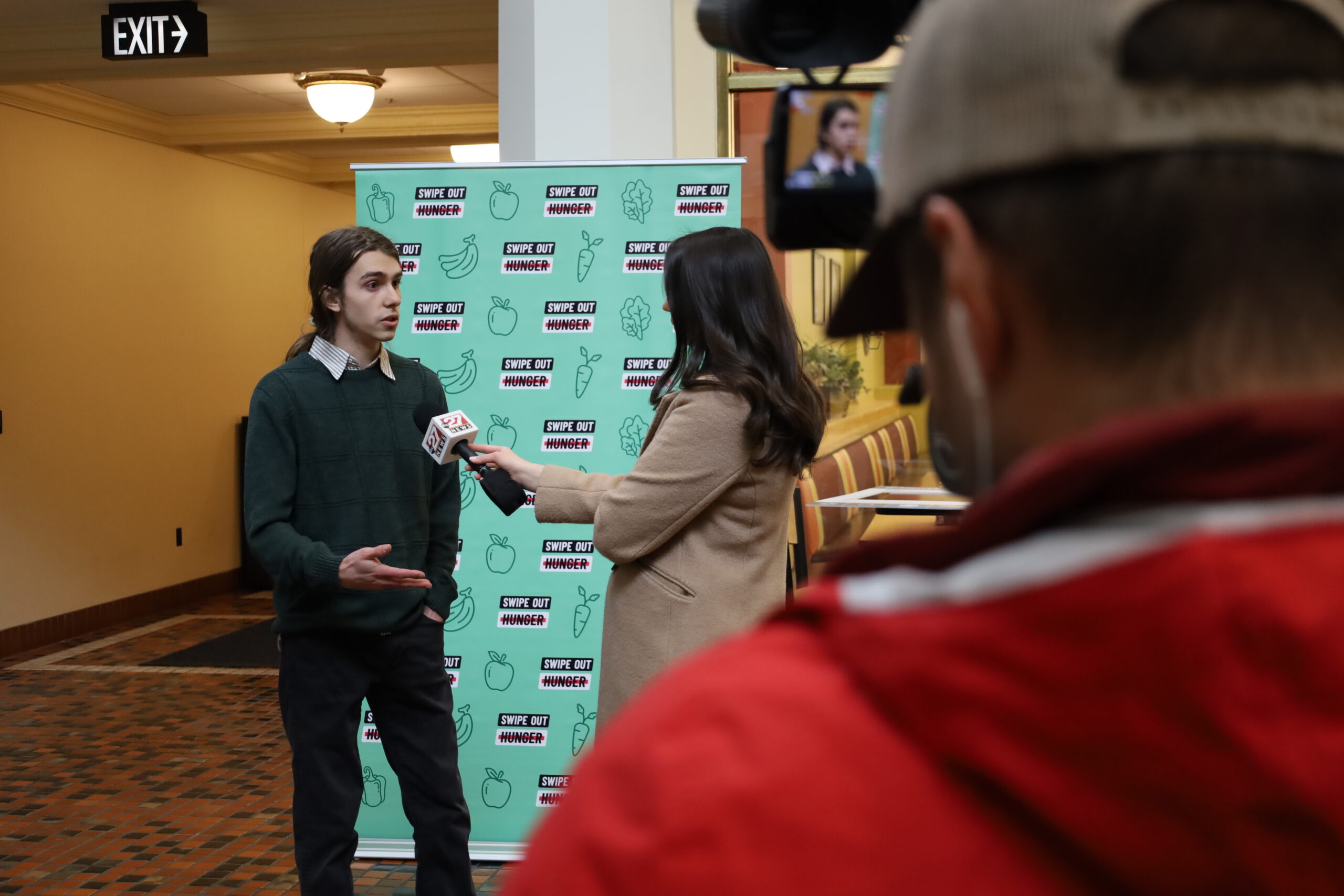 Student being interviewed by news reporter